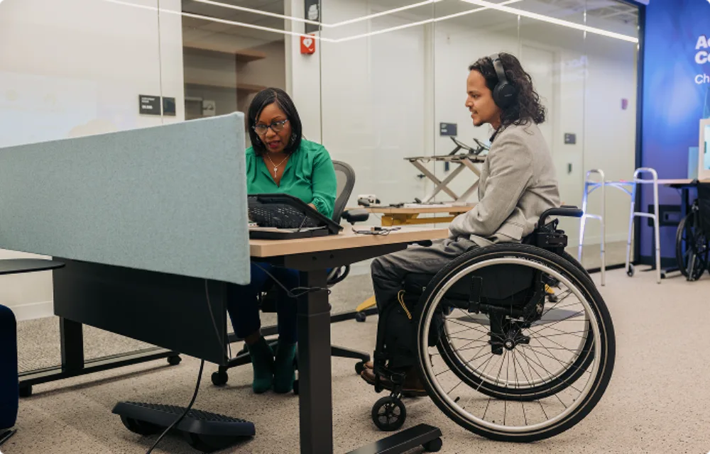 Two Colleagues Collaborate in an Accessibility Solutions Center 2