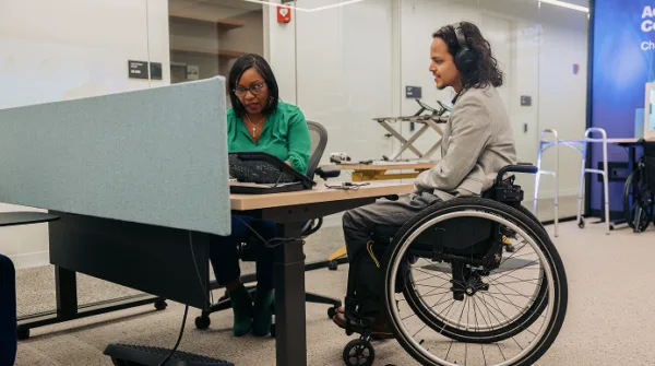 Two Colleagues Collaborate in an Accessibility Solutions Center 2